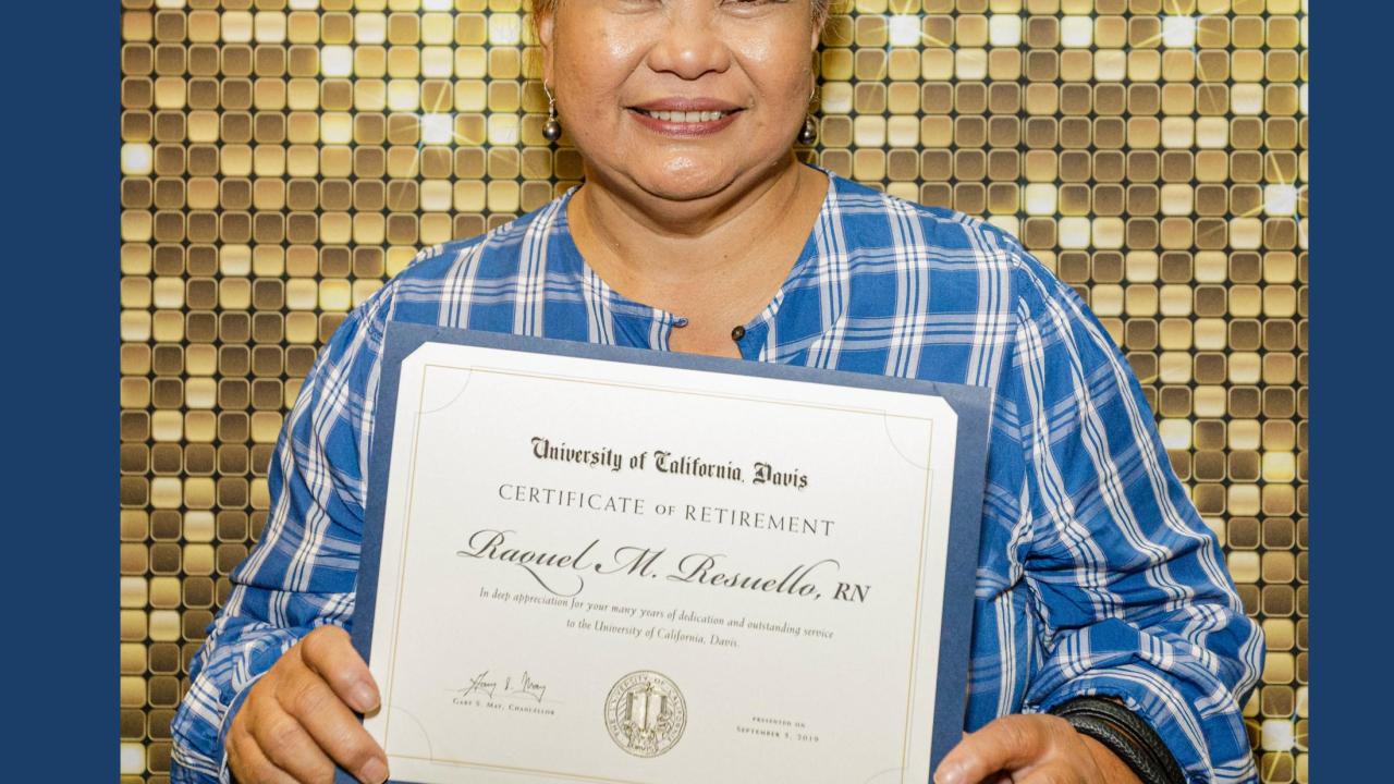 Smiling 2019 retiree with certificate